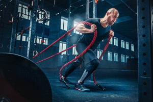 Men,With,Battle,Rope,Battle,Ropes,Exercise,In,The,Fitness 0