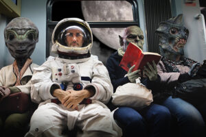 On,A,Spaceship,,An,Astronaut,,Sitting,Alongside,Extraterrestrial,Monsters,,Travel 0