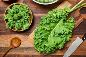 Concept,Of,Fresh,Kale,Leaves,Salad,On,Wooden,Table,Background. 0
