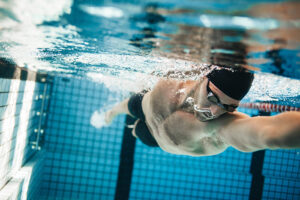 Fit,Swimmer,Training,In,The,Swimming,Pool.,Professional,Male,Swimmer 0